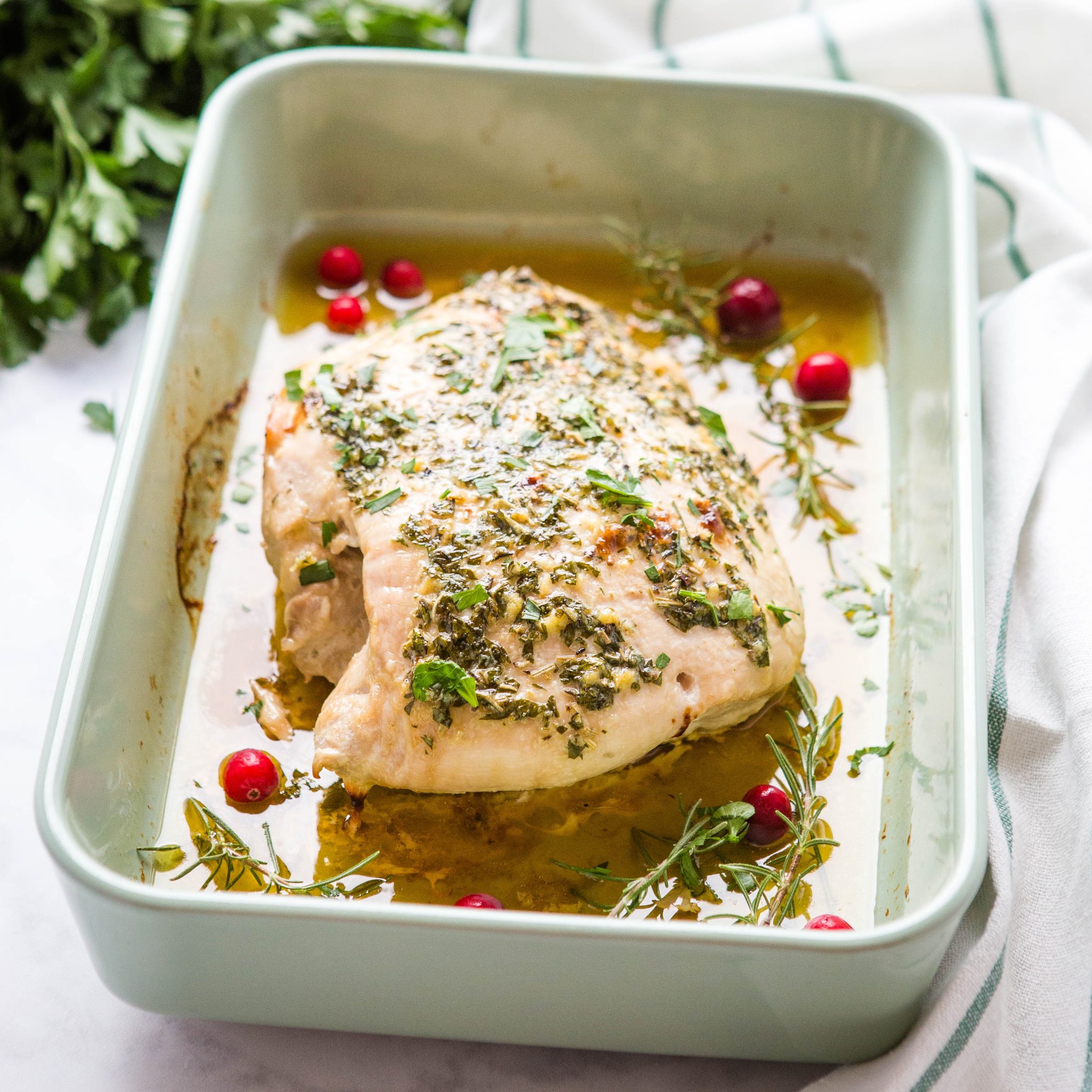 roasted boneless skinless turkey breast in a roasting pan