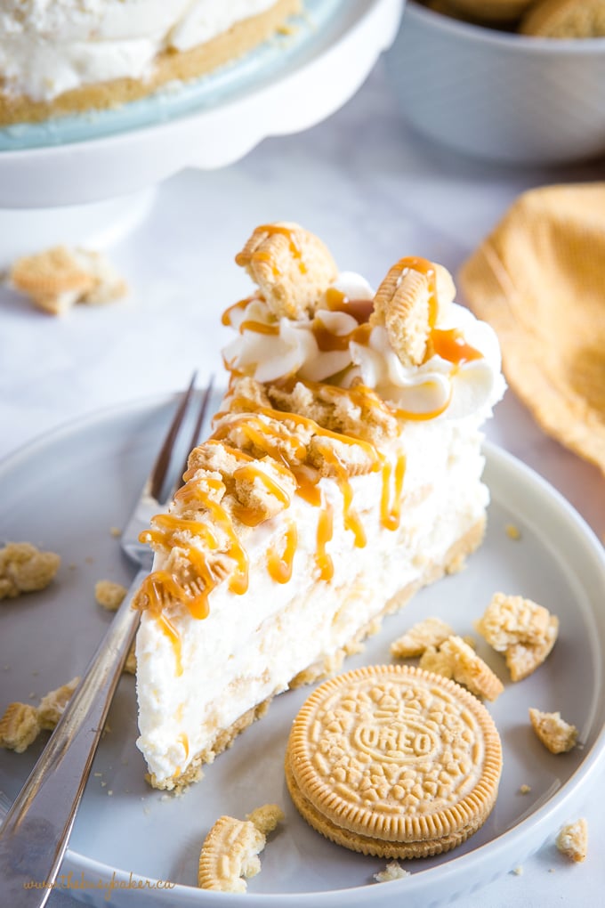 no bake cheesecake slice with vanilla Oreo cookies and caramel sauce on top