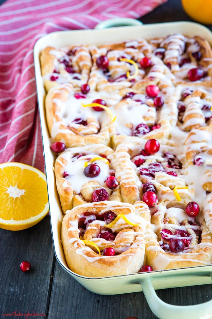 cranberry orange sweet rolls in green pan