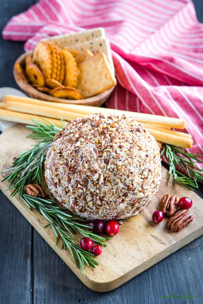cheese ball with crackers and cranberries