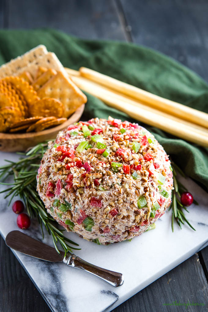 cheddar cheese ball recipe for Christmas, rolled in crispy bacon and scallions