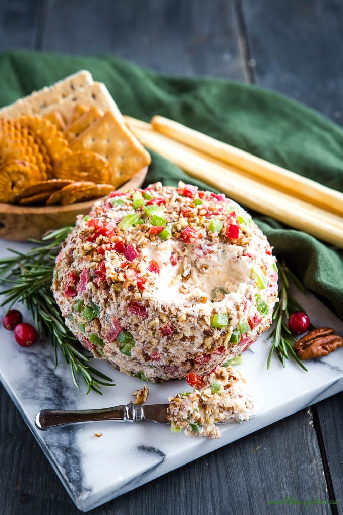 festive Christmas cheese ball with red and green toppings