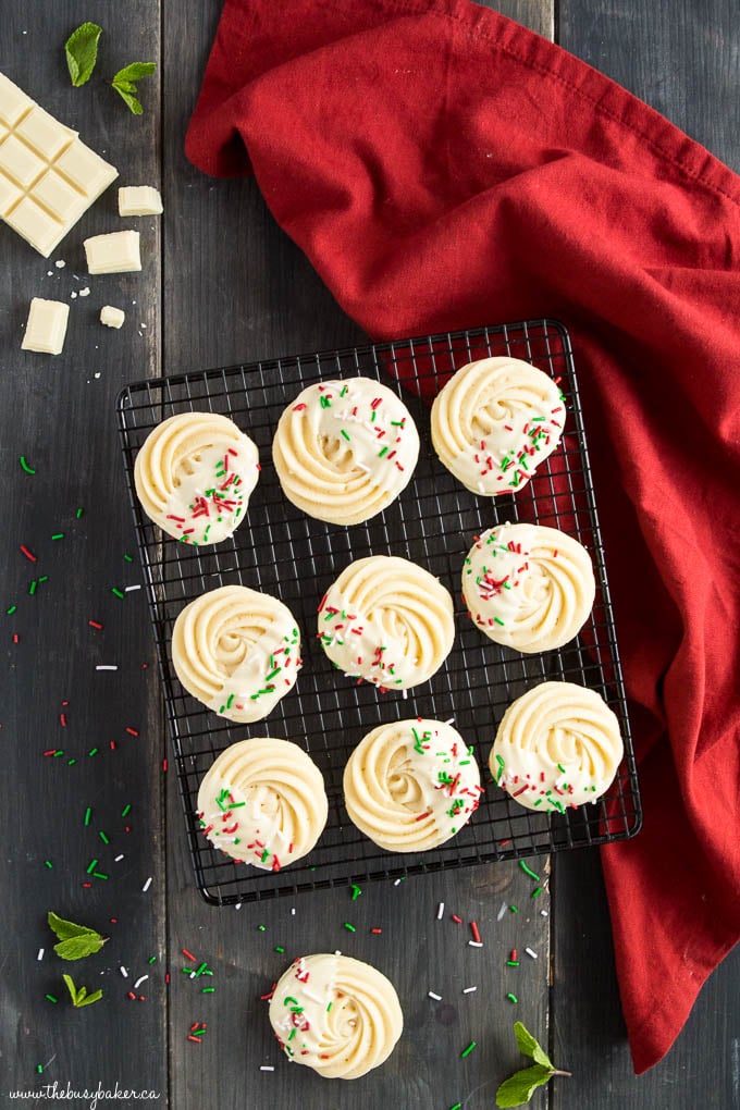 piped shortbread cookies dipped in white chocolate with sprinkles