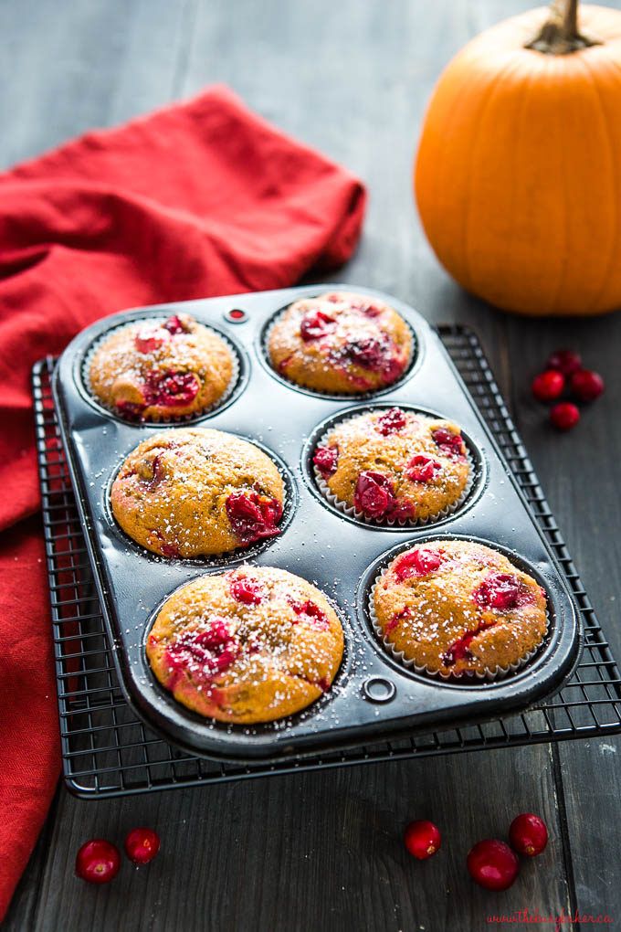 pumpkin cranberry muffins in black muffin tin