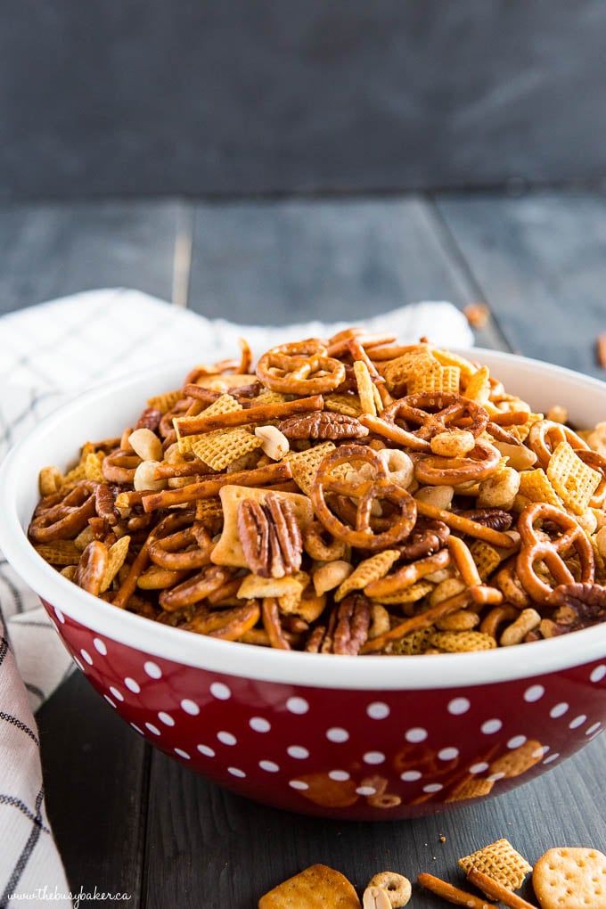 slow cooker nuts and bolts snack mix in red bowl