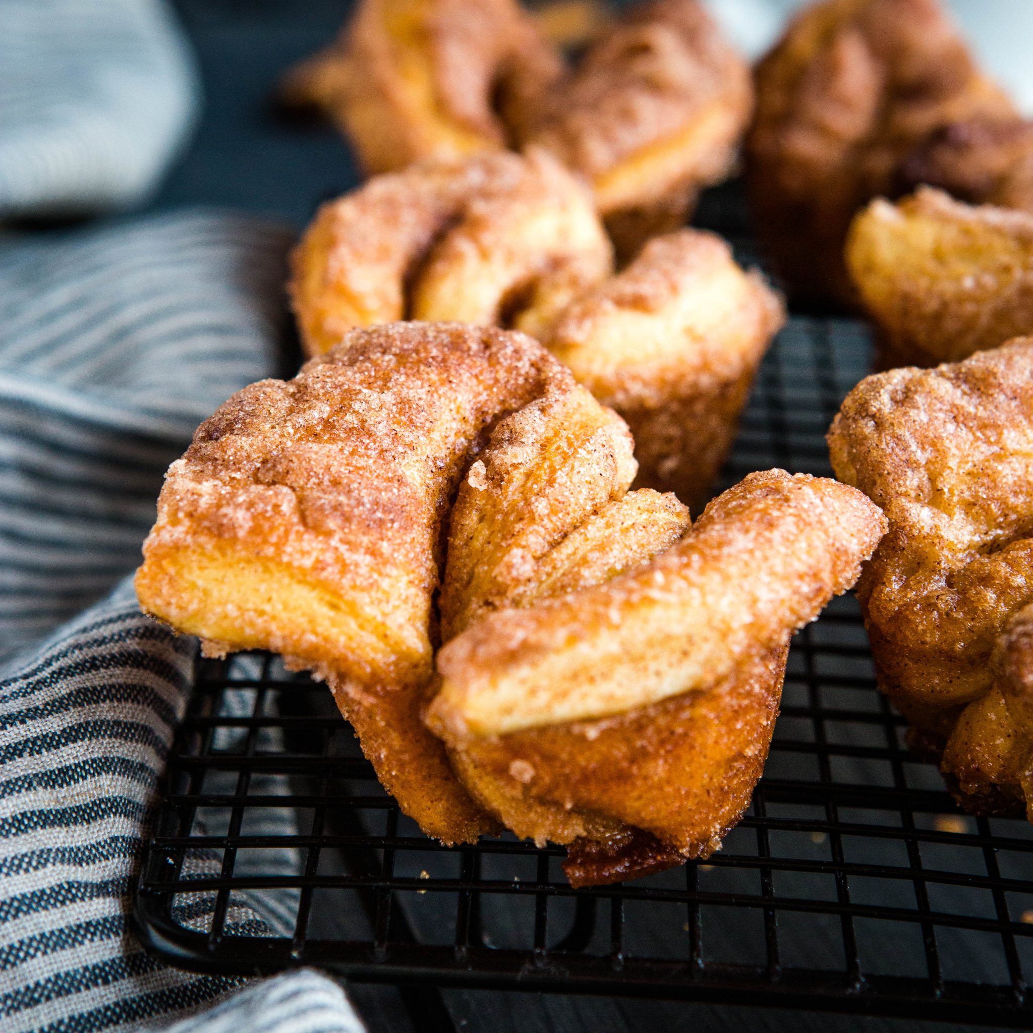 sugary cinnamon twists on a cooling rack