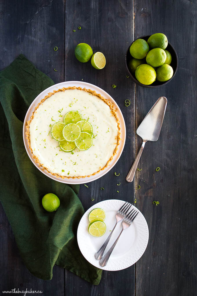 no bake key lime pie with limes, plates and forks