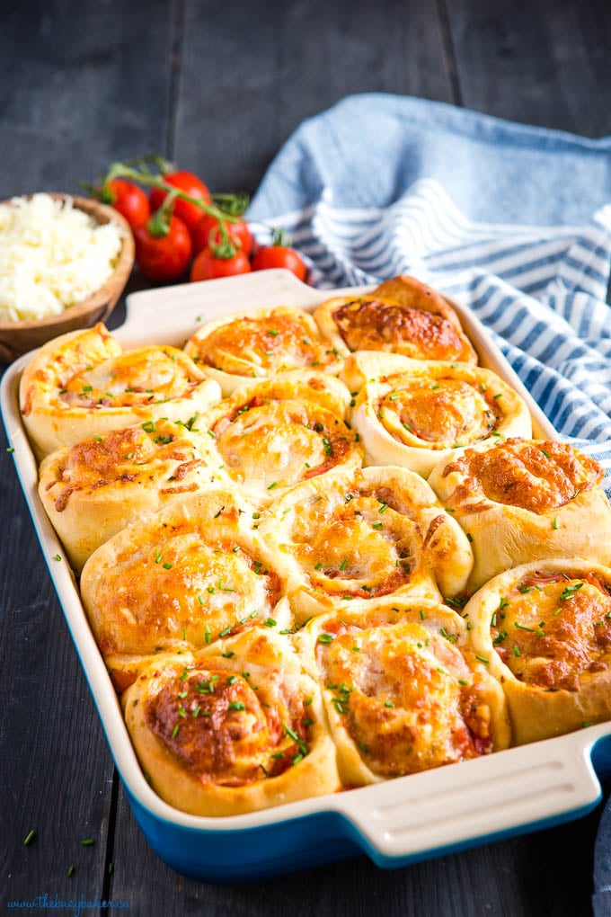 ham and cheese pizza rolls in blue baking pan