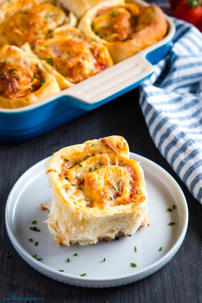 pizza roll on blue plate with cheese