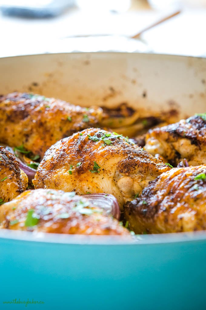 roasted chicken thighs in blue pan with herbs