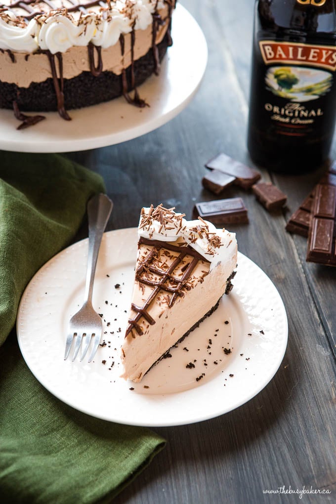 overhead shot: slice of irish cream cheescake on white plate with fork