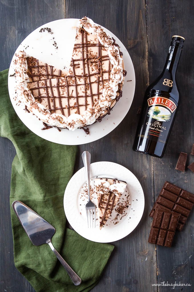 bottle of Bailey's Irish Cream next to a no bake St. Patrick's Day cheesecake