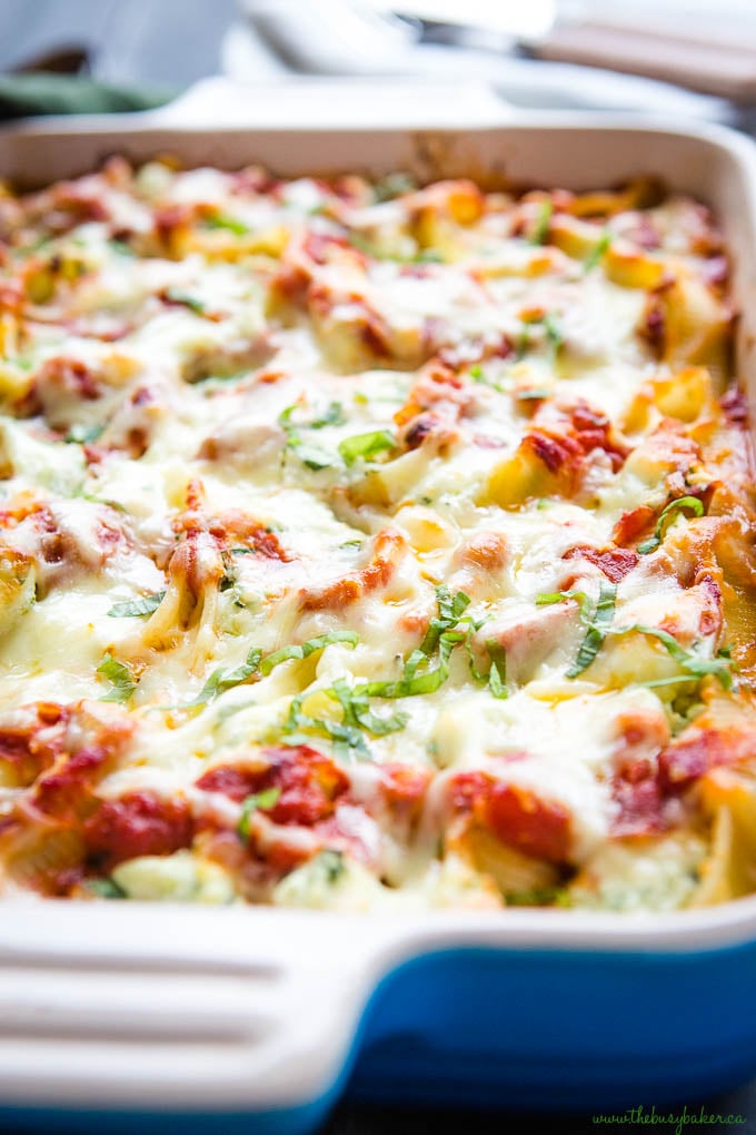 ricotta and spinach stuffed shells in blue casserole dish
