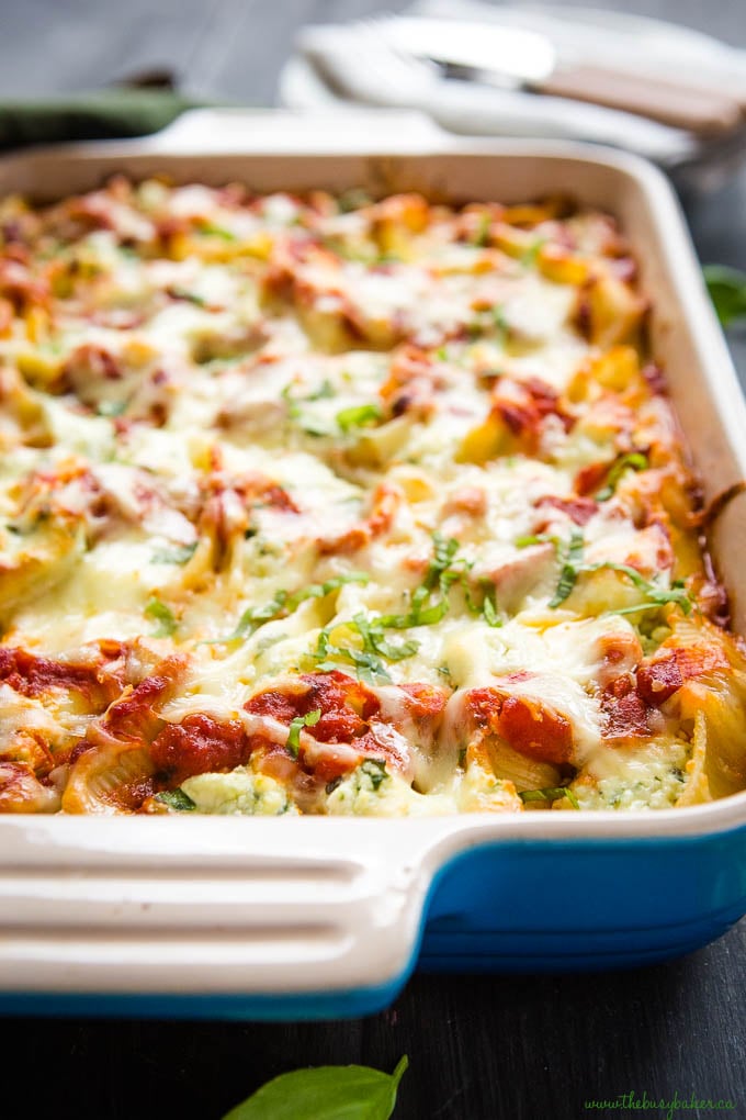 ricotta and spinach stuffed shells in blue casserole dish