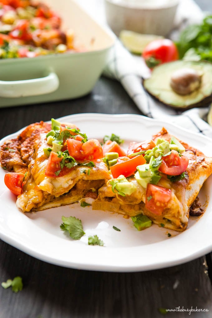 Sweet Potato Black Bean Enchiladas cut in half on white dinner plate