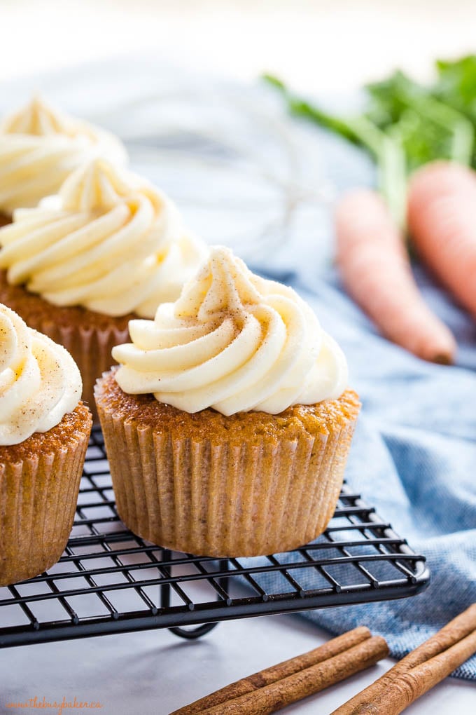 carrot cake cupcake with a swirl of cream cheese frosting and cinnamon sugar