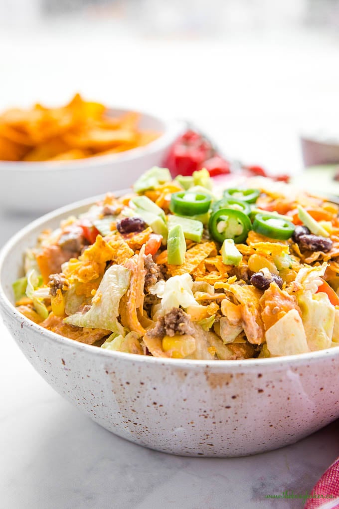 bowl of Mexican salad with ground beef and salsa sour cream salad dressing