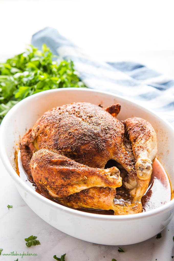 homemade rotisserie chicken in white baking dish