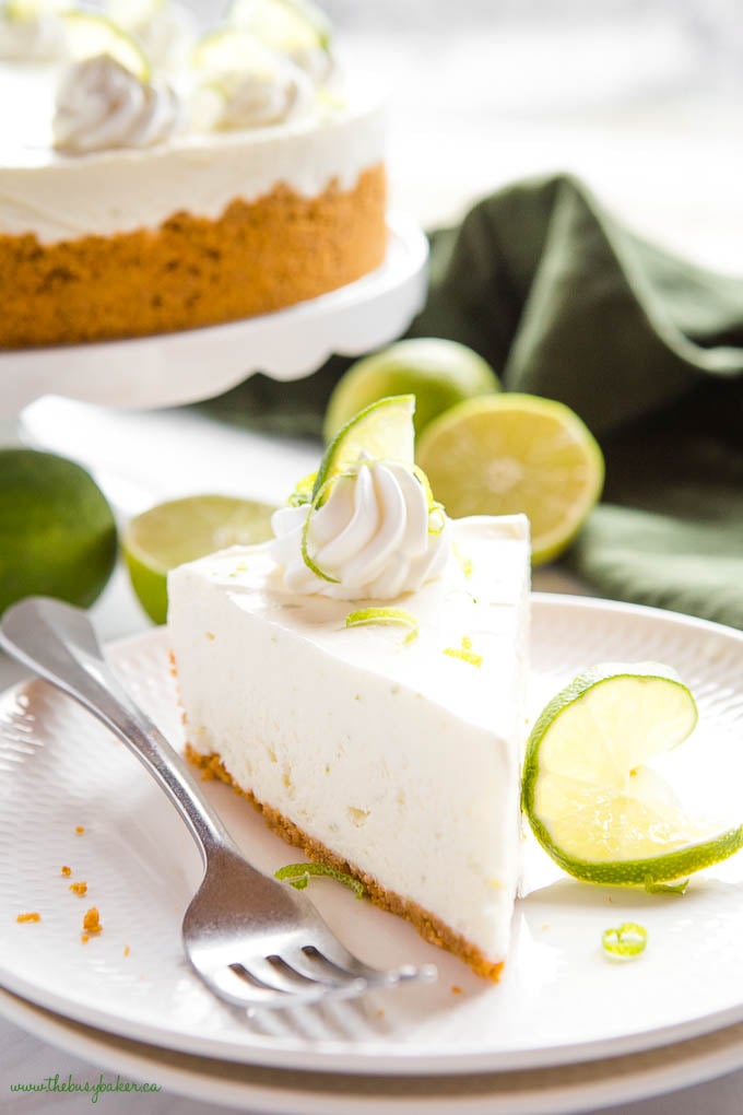 slice of key lime cheesecake with fresh lime slices