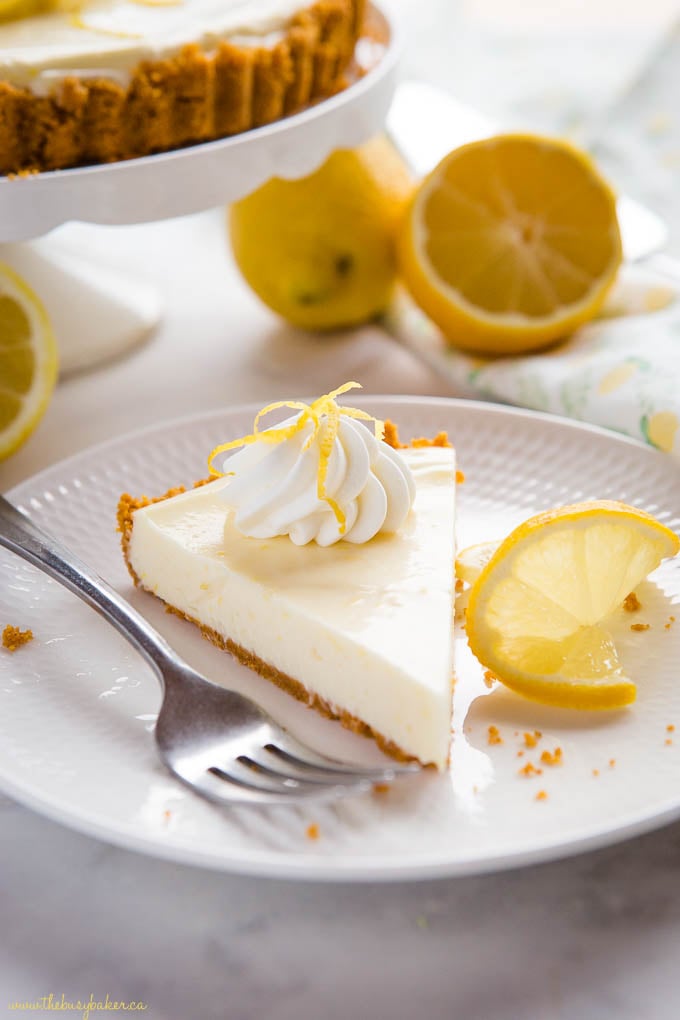 Slice of lemon tart on white plate