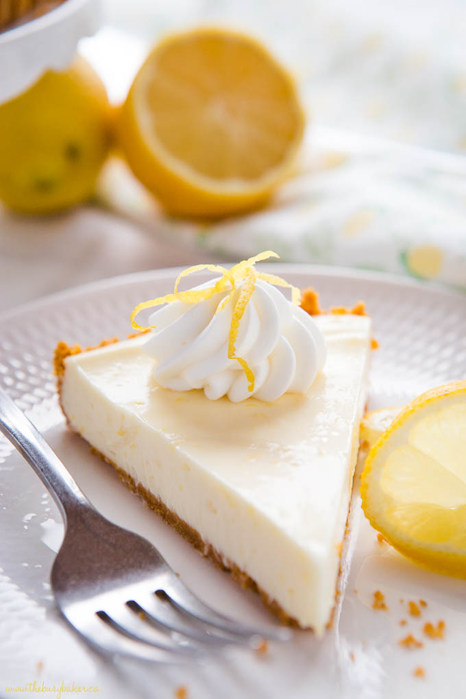 slice of creamy lemon tart with cream and lemon zest