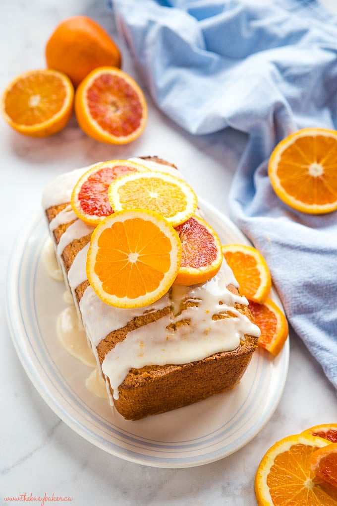 orange sour cream pound cake with orange slices and white glaze
