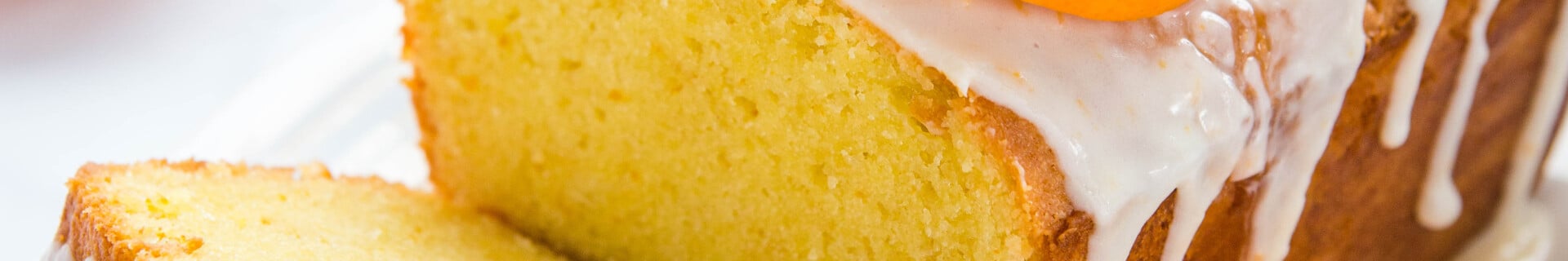 loaf of orange sour cream pound cake with citrus glaze