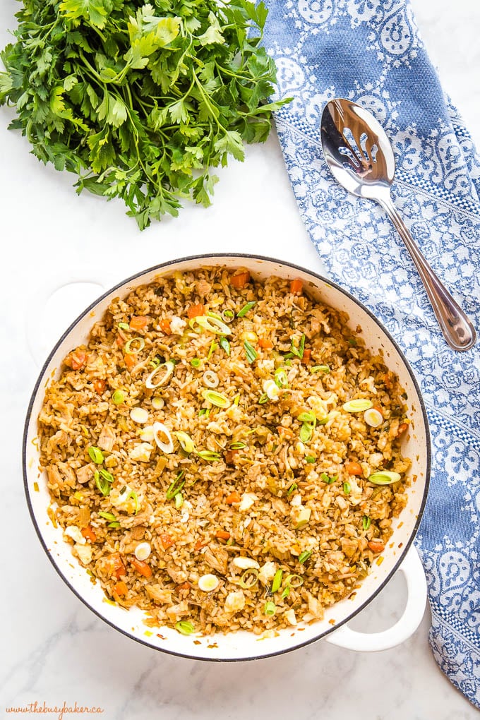 overhead image of fried rice with chicken in white pan