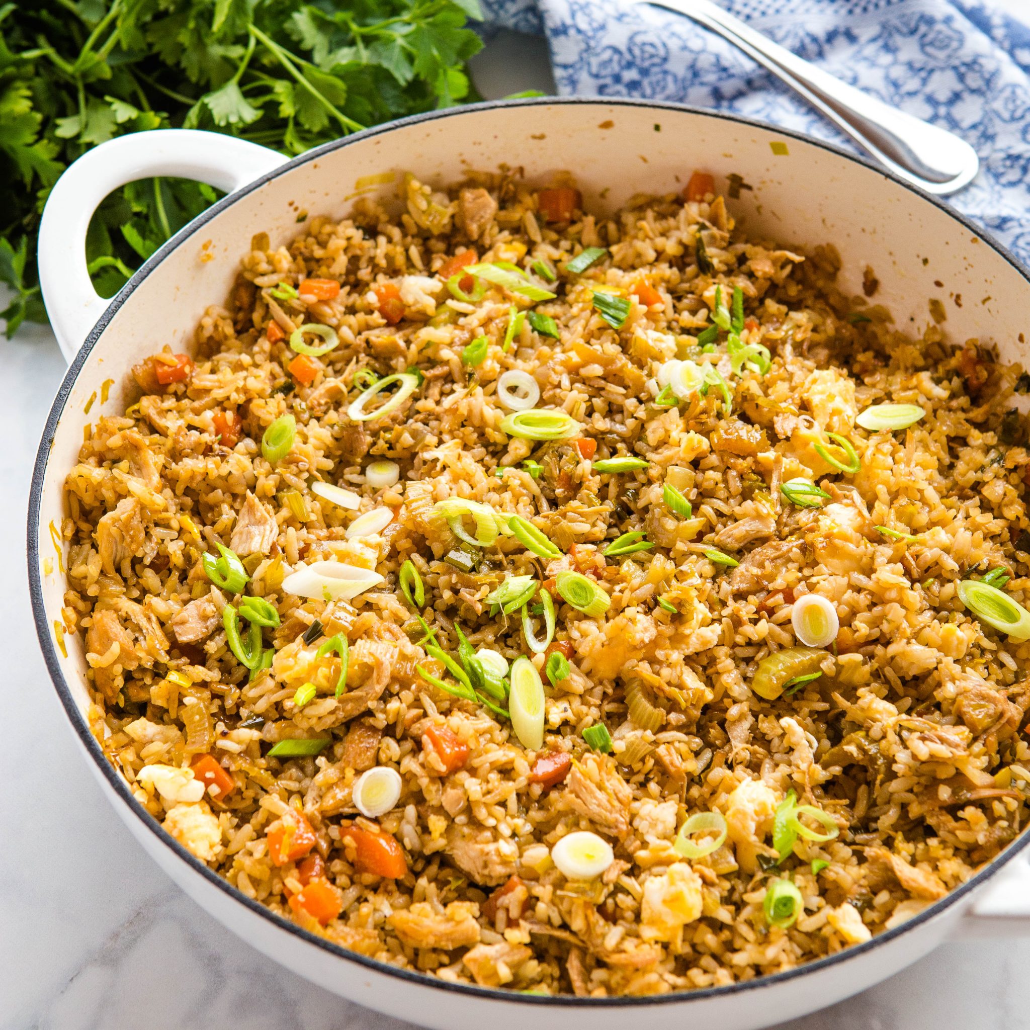 chicken fried rice recipe cooked in a white skillet