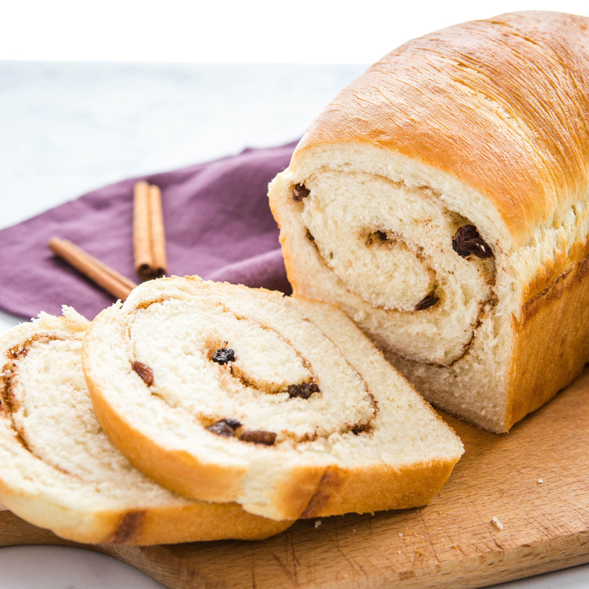 loaf of cinnamon raisin bread, cut in slices