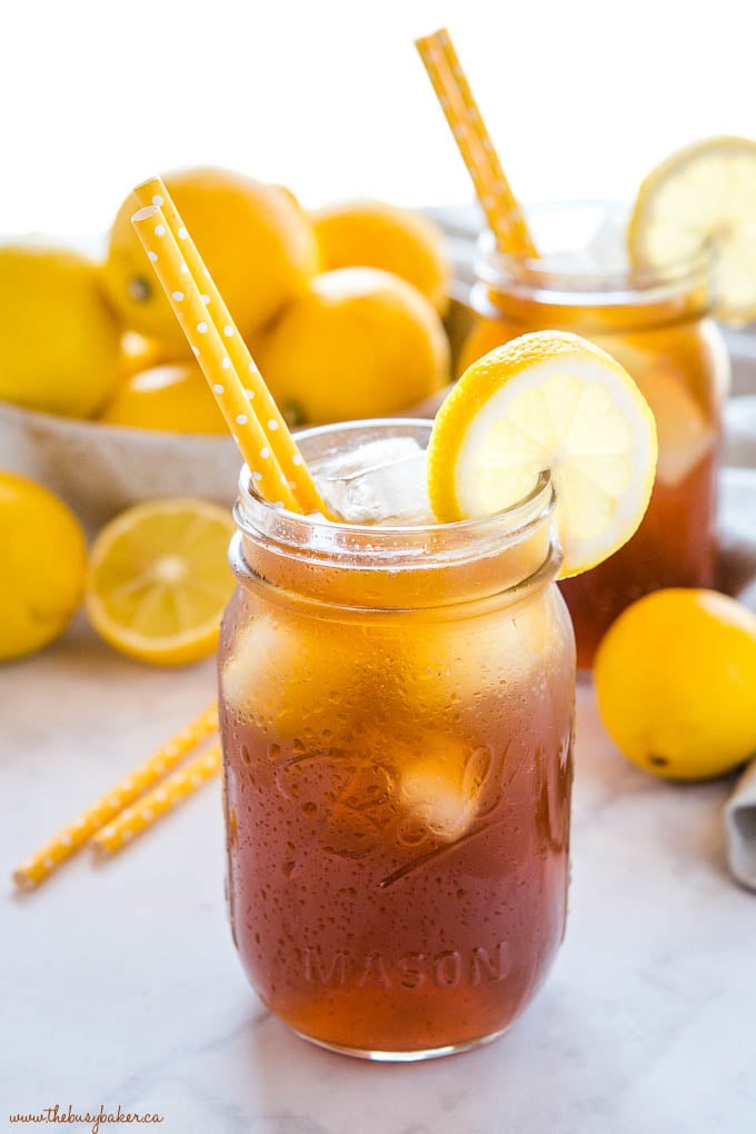 iced tea in mason jars with yellow straws