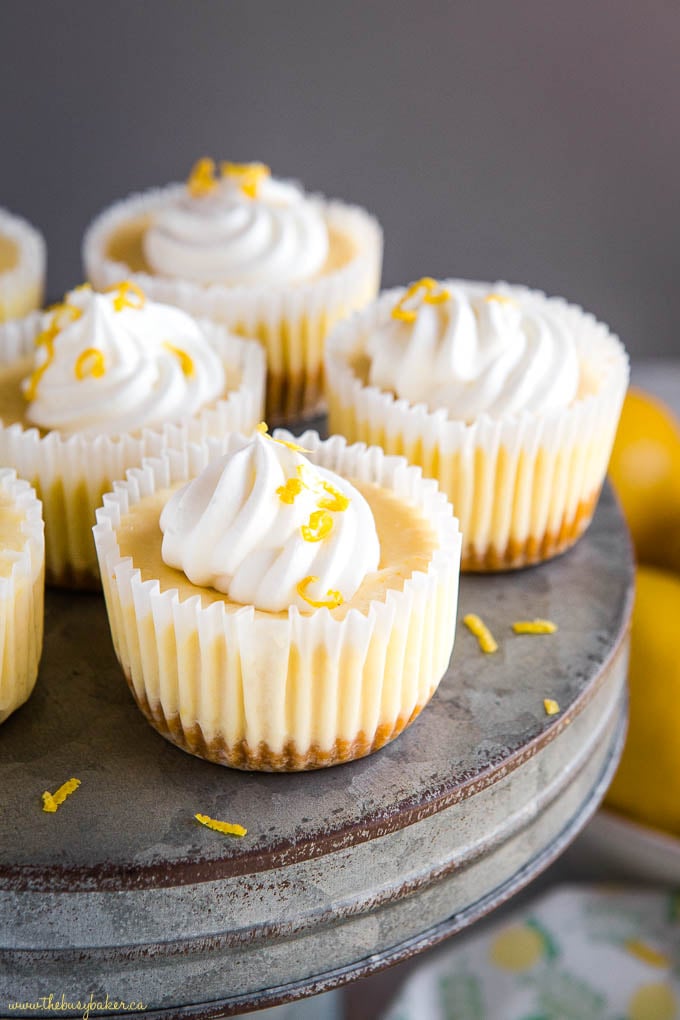 mini lemon cheesecakes on galvanized metal cake stand