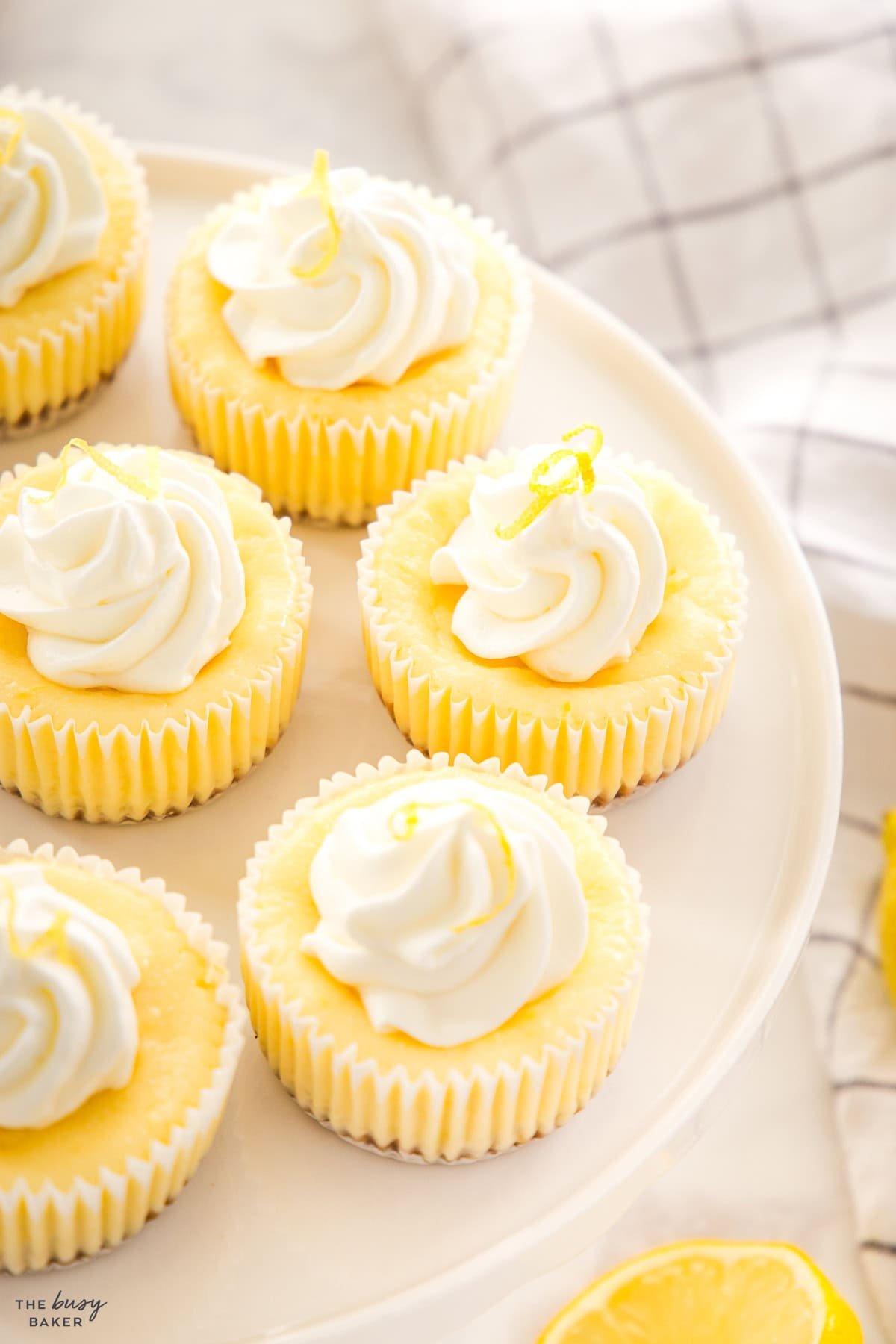 mini lemon cheesecake cups with whipped cream