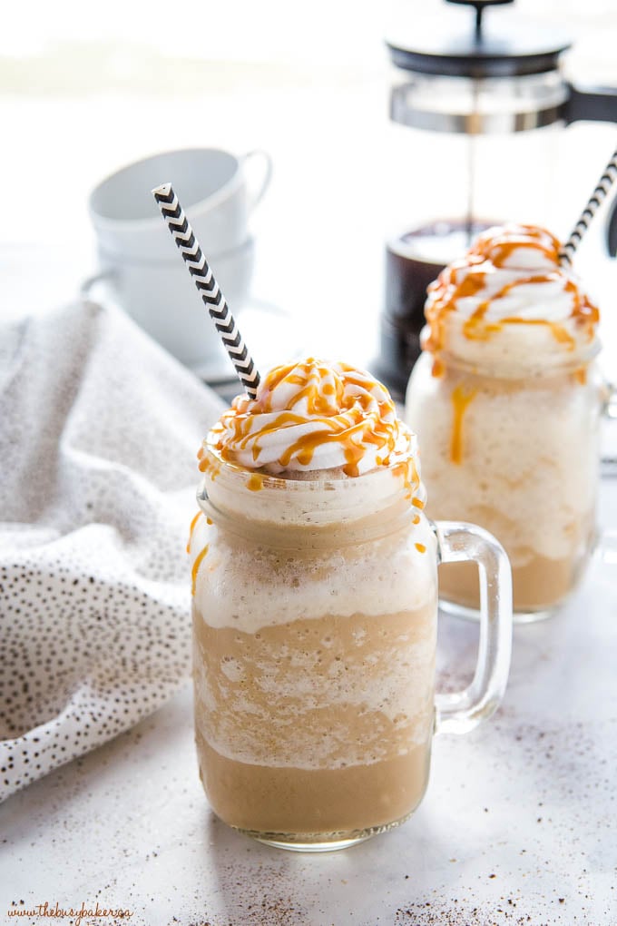 2 caramel blended coffee drinks with whipped cream and caramel sauce