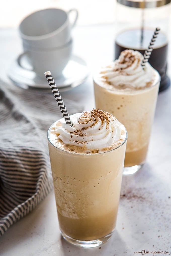 homemade frappuccinos with coffee cups in background