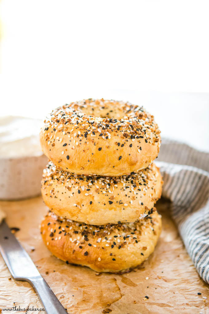 stack of 3 homemade everything bagels on brown parchment paper