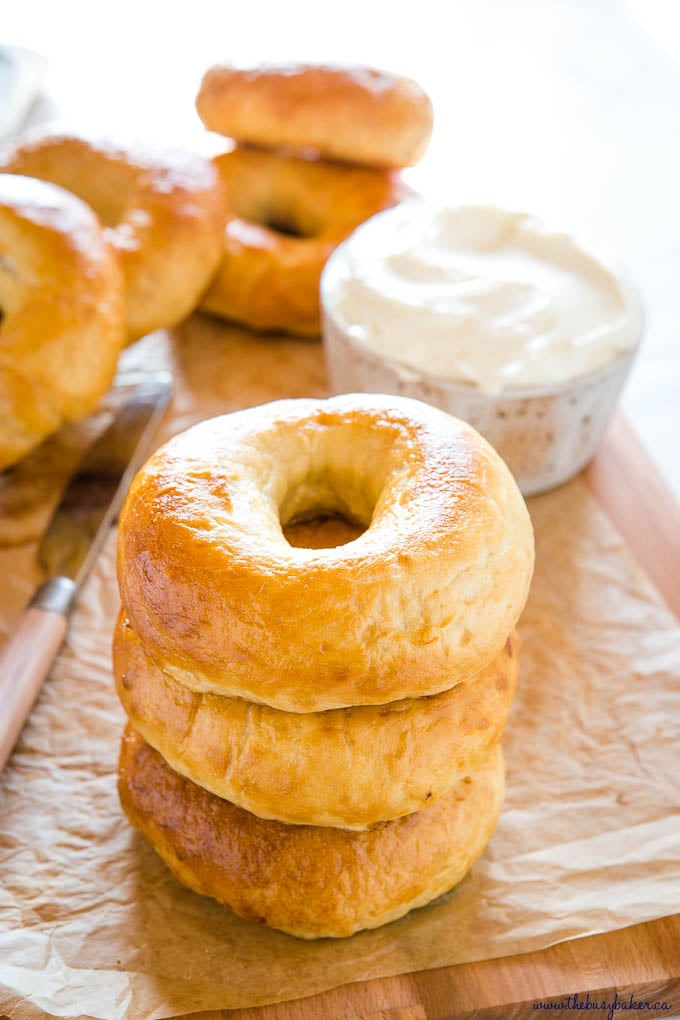 stack of 3 homemade bagels with cream cheese