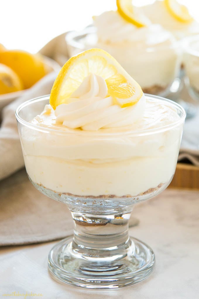 lemon cheesecake dessert with whipped cream and lemon slice