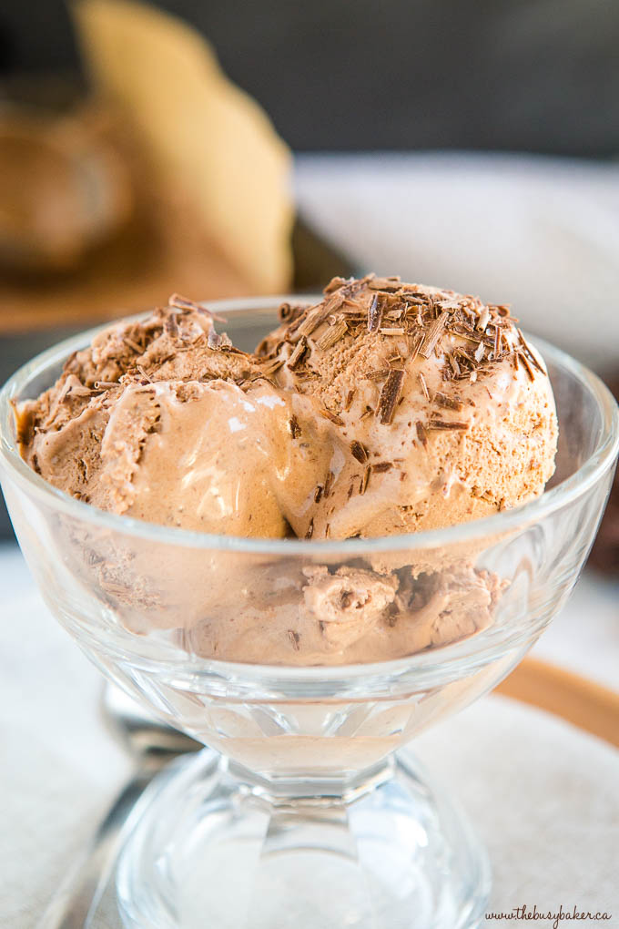 chocolate ice cream in glass dish with chocolate shavings