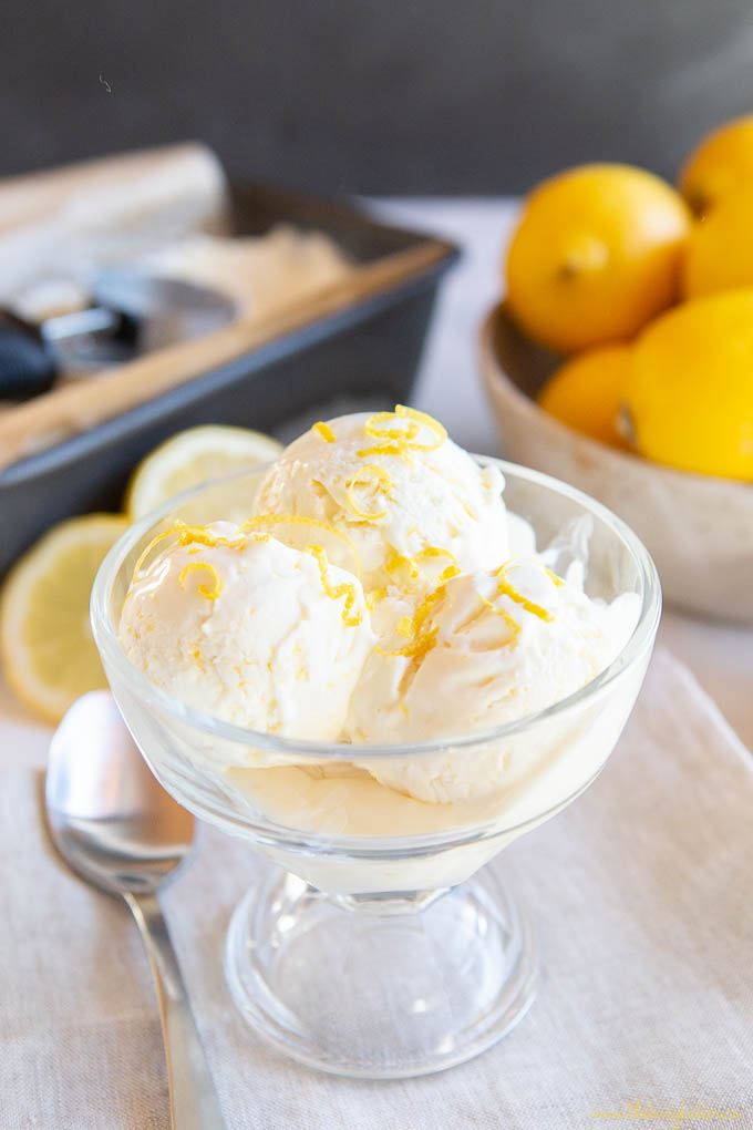 glass dish with lemon ice cream and lemon zest