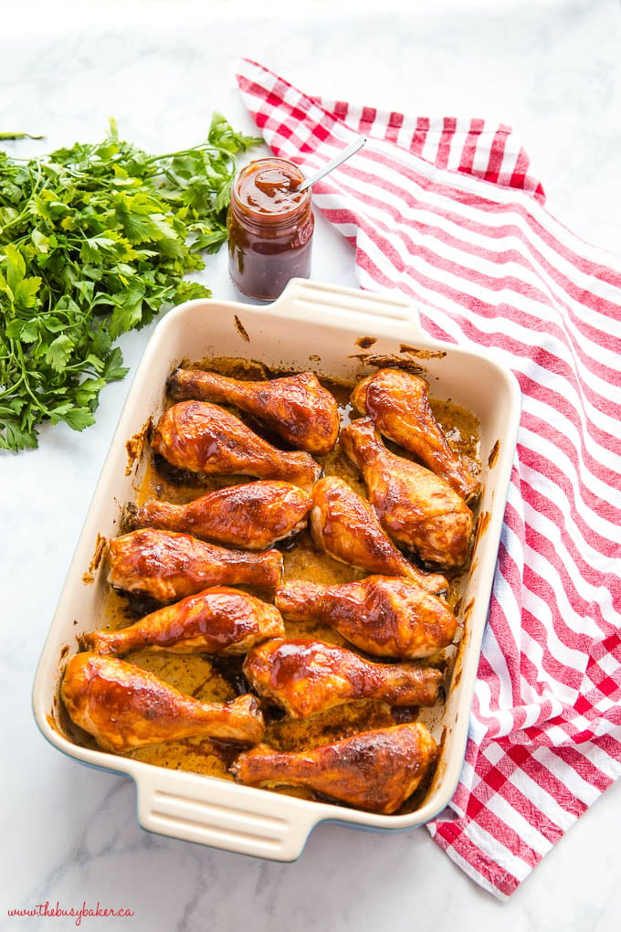 12 chicken drumsticks in Le Creuset casserole dish with barbecue sauce