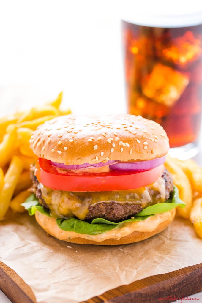 homemade cheeseburger with fries and coke with ice