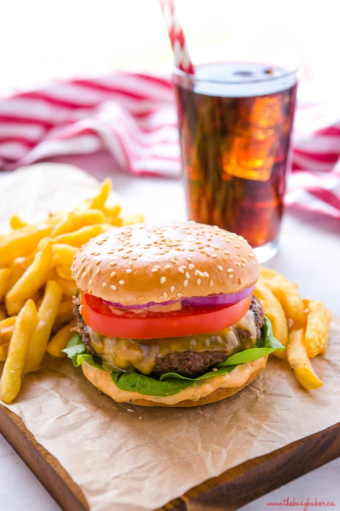 cheeseburger on platter with fries and coke