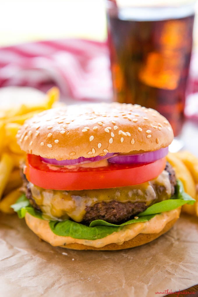 homemade cheeseburger on sesame seed bun