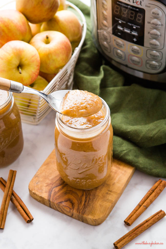 spoonful of homemade applesauce from a mason jar