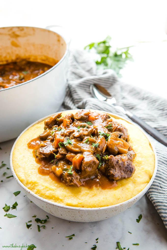 braised beef and mushrooms over a bowl of polenta