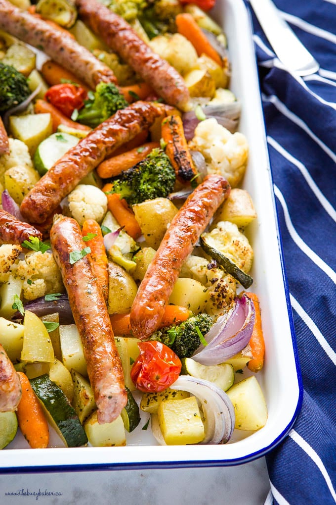 chicken sausages with potatoes, tomatoes, broccoli, red onions and baby carrots