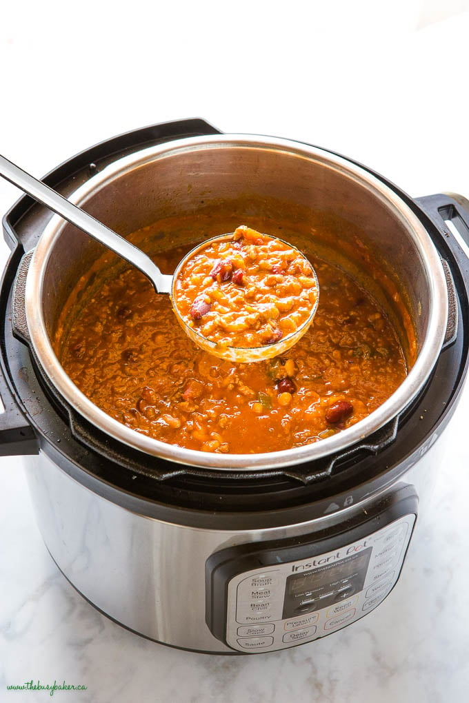 ladle of instant pot beef and bean chili in the Instant Pot