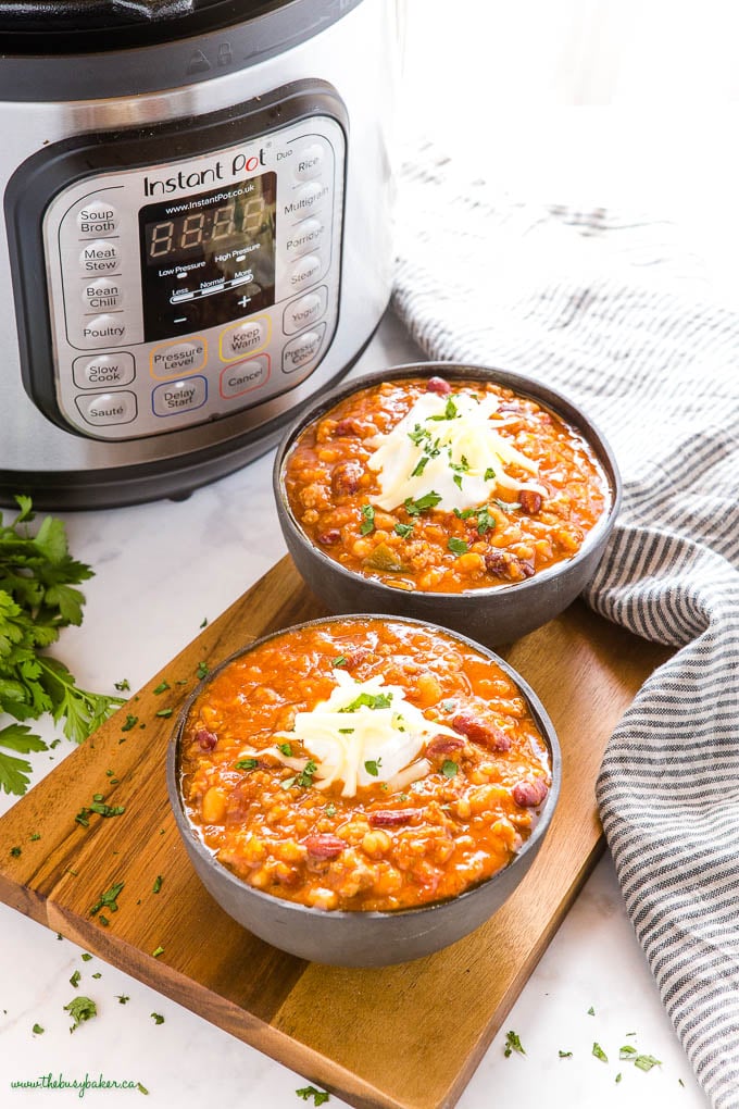 black bowls with beef and bean chili made in the Instant Pot