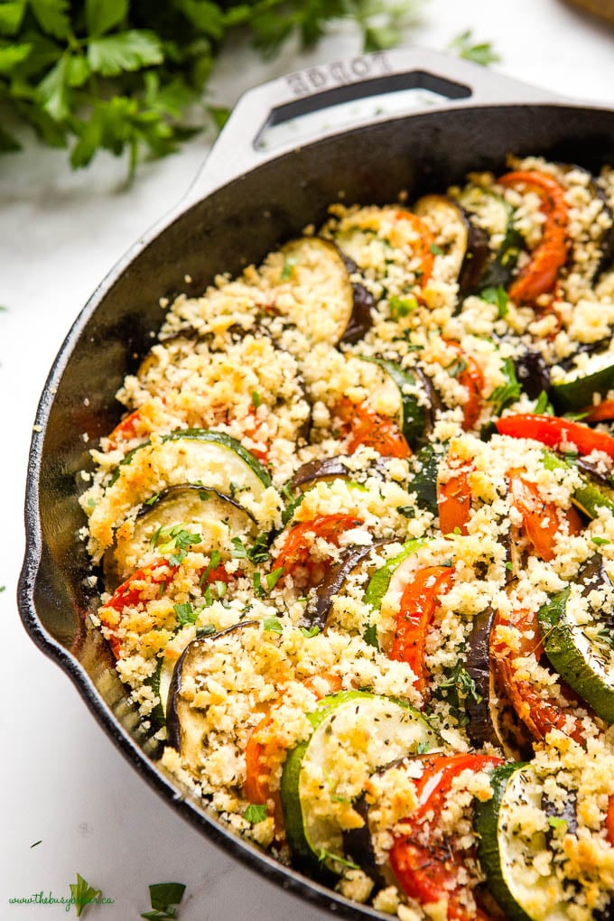 zucchini tomato eggplant gratin in cast iron skillet with crispy topping